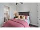 Bedroom with a comfortable bed and an attached bathroom, providing convenience and privacy at 1506 Euston Dr, Reunion, FL 34747