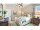 Comfortable bedroom with a decorative rug and a soft, green throw blanket at 1506 Euston Dr, Reunion, FL 34747
