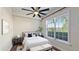 Cozy bedroom with a large window providing ample natural light at 1506 Euston Dr, Reunion, FL 34747
