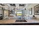 Open-concept kitchen with view to living area, pendant lighting, granite countertop and stainless steel sink at 1506 Euston Dr, Reunion, FL 34747