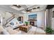Beautiful living room features a stone fireplace, coffered ceiling, and hardwood floors at 1506 Euston Dr, Reunion, FL 34747
