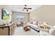 Bright living room featuring stylish furniture, a large window, and a neutral color palette at 1506 Euston Dr, Reunion, FL 34747
