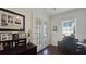 Bright office featuring dark wood floors, French doors, and a large desk at 1506 Euston Dr, Reunion, FL 34747
