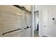 Luxurious shower with frameless glass door and modern fixtures, offering a spa-like experience at 1506 Euston Dr, Reunion, FL 34747