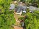 An appealing aerial view of home showcasing a luscious yard, stone patio, and mature trees at 1510 E Ridgewood St, Orlando, FL 32803