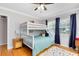 A bedroom featuring a bunk bed, modern fixtures, and hardwood floors at 1510 E Ridgewood St, Orlando, FL 32803
