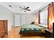 A sunlit bedroom featuring hardwood floors, neutral walls, and modern fixtures at 1510 E Ridgewood St, Orlando, FL 32803