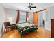 Bright bedroom with a ceiling fan, natural light, and a barn door at 1510 E Ridgewood St, Orlando, FL 32803