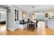 Dining area featuring a built-in banquette, farmhouse table, and stylish light fixture at 1510 E Ridgewood St, Orlando, FL 32803