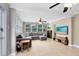 Bright living room with neutral tones, tile flooring, ceiling fans, and a large window overlooking the front yard at 1510 E Ridgewood St, Orlando, FL 32803
