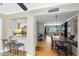 A open living area with hardwood floors, modern lighting, and stainless steel kitchen appliances at 1510 E Ridgewood St, Orlando, FL 32803
