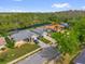 Aerial view of a neighborhood with lush greenery, waterfront access, and well-maintained homes at 1532 Reade Cir, St Cloud, FL 34772