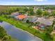Beautiful aerial view of homes with screened pools along a waterfront with mature trees in a desirable neighborhood at 1532 Reade Cir, St Cloud, FL 34772