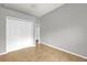 Neutral bedroom with tile floors, closet and trim with open door to additional room at 1532 Reade Cir, St Cloud, FL 34772