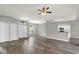 Open-concept living room with hard flooring and updated kitchen counter at 1532 Reade Cir, St Cloud, FL 34772