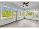 Enclosed sunroom has plenty of windows offering ample natural light and view of backyard at 1532 Reade Cir, St Cloud, FL 34772