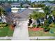 Beautiful aerial shot of home showcasing solar panels, landscaping, and surrounding neighborhood at 1599 Thetford Cir, Orlando, FL 32824