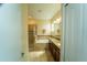 Elegant bathroom with a soaking tub, a walk-in shower, and dual vanities at 1599 Thetford Cir, Orlando, FL 32824