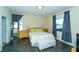 Comfortable bedroom with natural light and modern furnishings, including a storage bench at 1599 Thetford Cir, Orlando, FL 32824