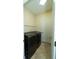 Convenient laundry room with modern washer and dryer, shelving and tiled flooring at 1599 Thetford Cir, Orlando, FL 32824
