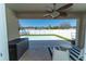 Covered patio overlooking a refreshing pool and fenced backyard, perfect for relaxing at 1599 Thetford Cir, Orlando, FL 32824