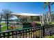 Community playground area with slides, covered play structures and green space at 1599 Thetford Cir, Orlando, FL 32824