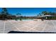 Outdoor pool area with palm trees, lounge chairs and shaded seating at 1599 Thetford Cir, Orlando, FL 32824
