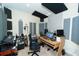 Acoustically treated studio space with recording equipment, musical instruments, and a comfortable workspace at 1599 Thetford Cir, Orlando, FL 32824