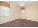 Comfortable bedroom with neutral walls, carpet flooring, and natural light from two windows at 1607 Tail Feather Dr, Kissimmee, FL 34746