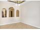 Elegant dining room with tile floors, decorative arches, and neutral paint at 1607 Tail Feather Dr, Kissimmee, FL 34746