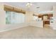 Spacious living area with tile floors, large windows, and open access to the kitchen at 1607 Tail Feather Dr, Kissimmee, FL 34746