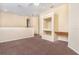 Open loft area with built-in desk, neutral carpet and ceiling fan at 1607 Tail Feather Dr, Kissimmee, FL 34746