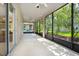 Enclosed patio with screens and a ceiling fan, offering a serene outdoor living space at 1607 Tail Feather Dr, Kissimmee, FL 34746