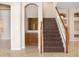 Staircase with carpet runner, wooden banister and railing at 1607 Tail Feather Dr, Kissimmee, FL 34746