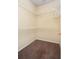 Spacious walk-in closet featuring carpeted floors and metal shelving at 1607 Tail Feather Dr, Kissimmee, FL 34746