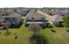 Spacious backyard with a large tree and well-maintained lawn, perfect for outdoor activities at 1915 Acacia Dr, Kissimmee, FL 34758