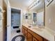 Bathroom features a double vanity, large mirror and great lighting, creating a perfect space to unwind at 1915 Acacia Dr, Kissimmee, FL 34758