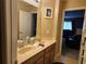 Bathroom featuring double sinks, granite countertops, and updated fixtures at 1915 Acacia Dr, Kissimmee, FL 34758