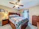This cozy bedroom showcases coastal themed decor, ceiling fan, and plenty of storage space at 1915 Acacia Dr, Kissimmee, FL 34758