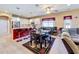 Dining area adjacent to kitchen, complete with table and seating, and bar stools at 1915 Acacia Dr, Kissimmee, FL 34758