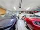 Well-lit garage with space for two cars and storage, showcasing a clean and organized area for vehicles and household items at 1915 Acacia Dr, Kissimmee, FL 34758