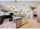 Bright, open kitchen with stainless appliances, center island, and tile flooring at 1915 Acacia Dr, Kissimmee, FL 34758
