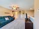 Bright living room with neutral walls, plush carpet and lots of natural light, a cozy space for gathering at 1915 Acacia Dr, Kissimmee, FL 34758