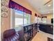 A view of the living room that includes a wet bar and window with valance at 1915 Acacia Dr, Kissimmee, FL 34758