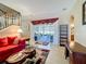 Cozy living room with an open floor plan, seamlessly blending with the outdoor patio at 1915 Acacia Dr, Kissimmee, FL 34758