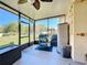 Screened patio featuring a grill and outdoor storage, perfect for relaxing and entertaining at 1915 Acacia Dr, Kissimmee, FL 34758