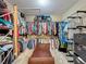 Large walk-in closet with extensive hanging racks and storage for clothes and accessories at 1915 Acacia Dr, Kissimmee, FL 34758