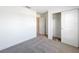Neutral bedroom features carpet floors, a closet, and a door to the hallway at 219 Summerlin Loop, Haines City, FL 33844