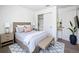This bedroom features a comfortable bed, stylish furniture, and a well-organized closet for optimal living at 219 Summerlin Loop, Haines City, FL 33844