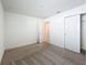 Empty bedroom with closet, neutral carpet, and ample space, ready for customization and personalized style at 219 Summerlin Loop, Haines City, FL 33844